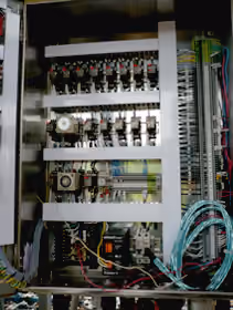 Internal wiring and relays of a burner control panel