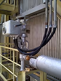 Actuated valve mounted on plant pipework with control tubing connected
