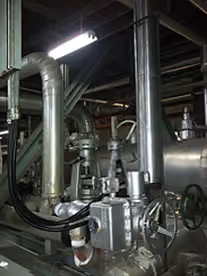 Installed valve and instrument conduit on process pipework inside a plant